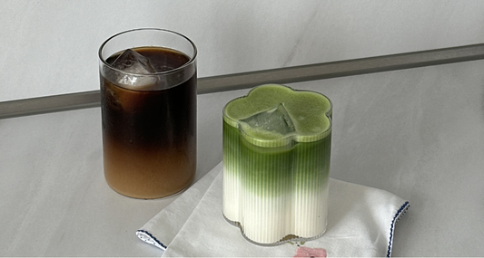 Matcha bowl and coffee cup side by side showing energy comparison