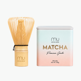 Matcha Union Premium Matcha Kit with a 100g tin of Shizuoka matcha and a logo-engraved bamboo whisk, for preparing smooth daily lattes.
