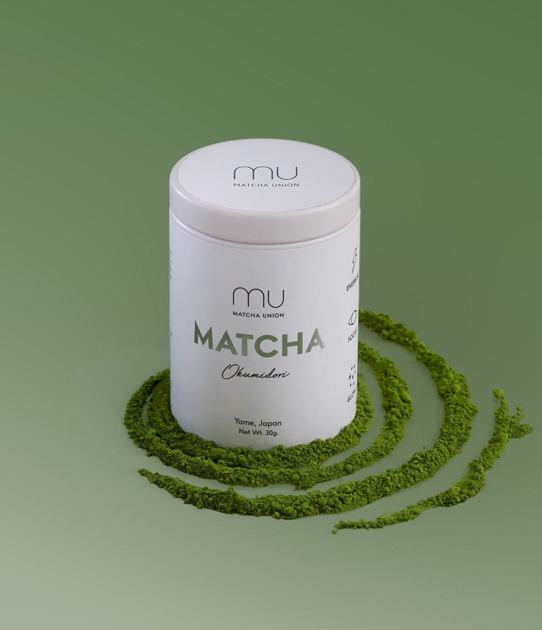 Matcha Union Okumidori Matcha 30g tin surrounded by rings of green matcha powder on a green background.