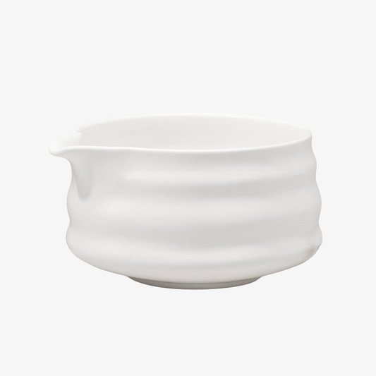 Matcha Union handmade ceramic matcha bowl with a cotton-white matte finish, ridged sides and a spout for easy pouring.
