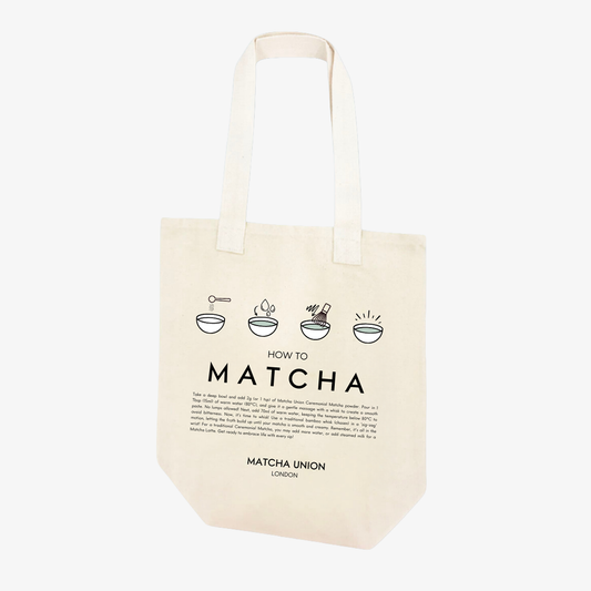 Cream Matcha Union tote bag with long handles and a black ‘How to Matcha’ print illustrating the steps for preparing matcha.