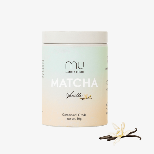 Matcha Union Vanilla Matcha 30g tin beside vanilla pods and a white flower, containing ceremonial-grade matcha with natural vanilla flavouring.